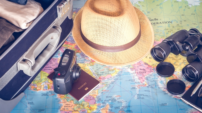 travel-pack-a-suitcase-bag-luggage-hat-camera-map-supplies.jpg