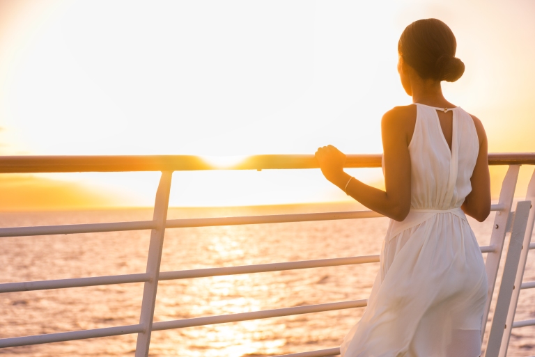 cruise-ship-woman-traveler-sunset.jpg